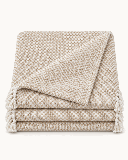 Basketweave Cotton Throw, folded on a plain background
