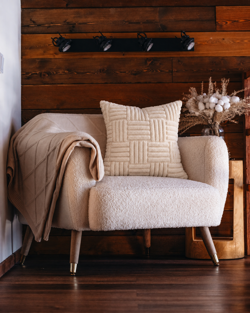 Basketweave Tufted Cotton Pillow Cover in Ivory, on a rattan armchair