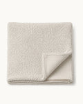 Bouclé Throw Pillow Cover — folded set on a plain background