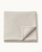 Bouclé Throw Pillow Cover — folded set on a plain background