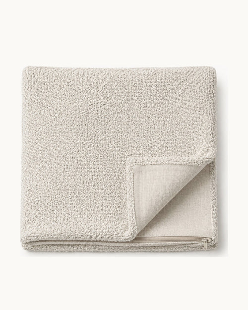 Bouclé Throw Pillow Cover — folded set on a plain background