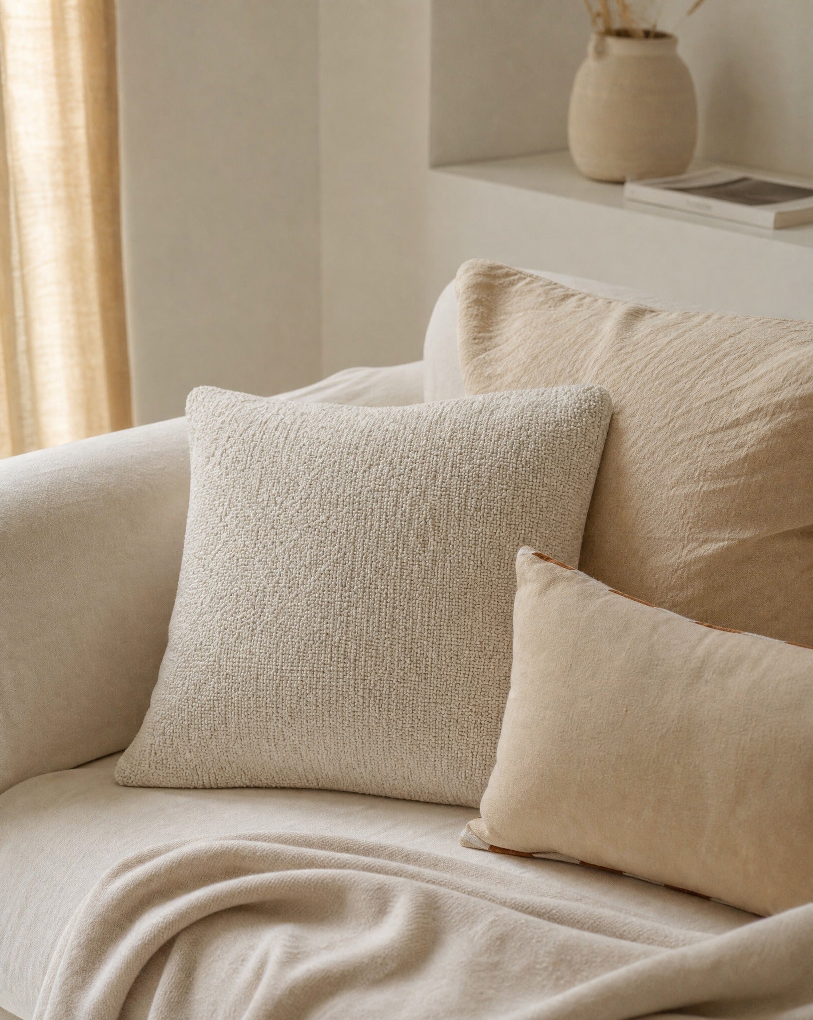 Bouclé Throw Pillow Cover — styled on a sofa in a living room