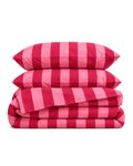 Cabana Stripe Cotton Sateen Duvet Cover Set in Pink & Red, folded with its shams