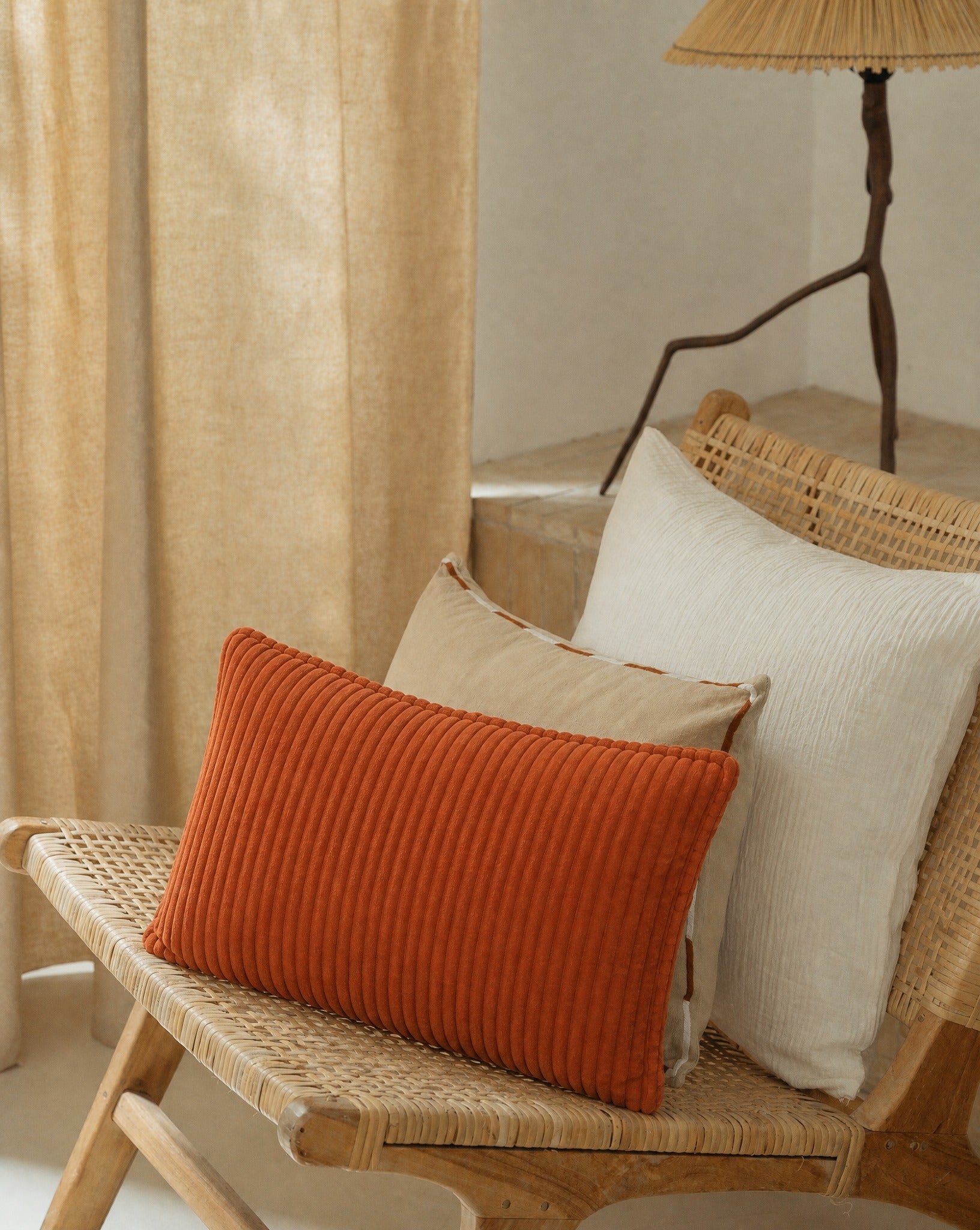 Corduroy Velvet Pillow Cover — grouped with other cushions on a bench