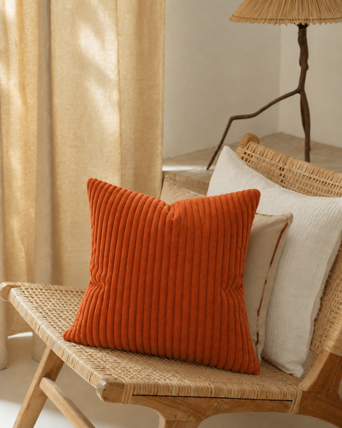 Corduroy Velvet Pillow Cover, grouped with other cushions on a bench