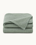 Cotton Gauze Throw — folded set on a plain background
