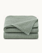Cotton Gauze Throw — folded set on a plain background
