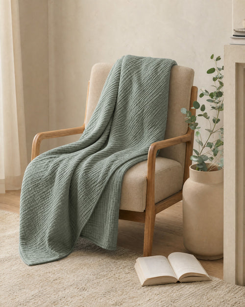 Cotton Gauze Throw — draped over a wooden armchair