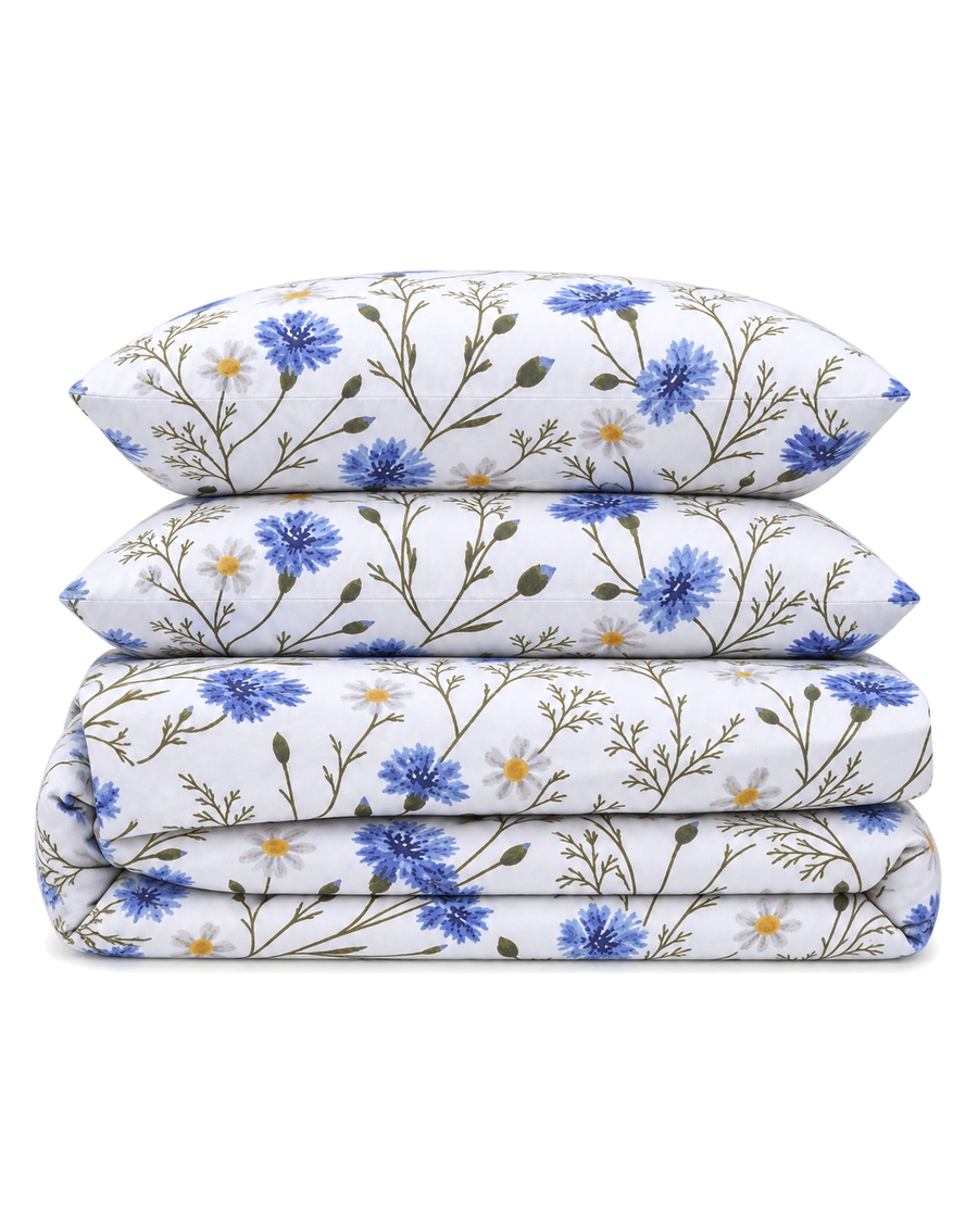 Floral Percale Sheet Set, the four pieces of the set folded on a plain background