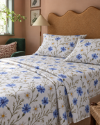 Floral Percale Sheet Set, on a made bed in morning light