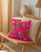 Dancing Skeletons Cotton Velvet Pillow Cover, on a rattan armchair