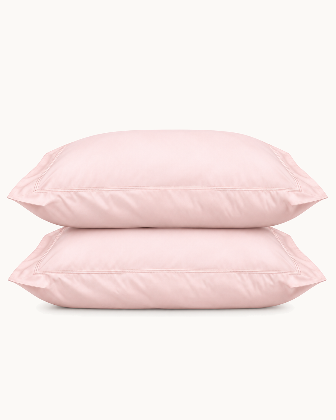 Egyptian Cotton Sateen Shams, one filled and one folded, the flange visible, on a plain background