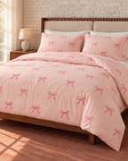 Embroidered Bow Cotton Sateen Duvet Cover Set in Blush, made bed seen from above