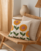Embroidered Flower Linen Pillow Cover, on a rattan armchair