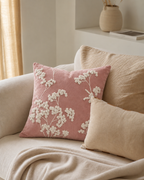 Embroidered Sprig Cotton Velvet Pillow Cover in Rose, on a linen sofa