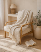 Basketweave Cotton Throw, draped over a wooden armchair