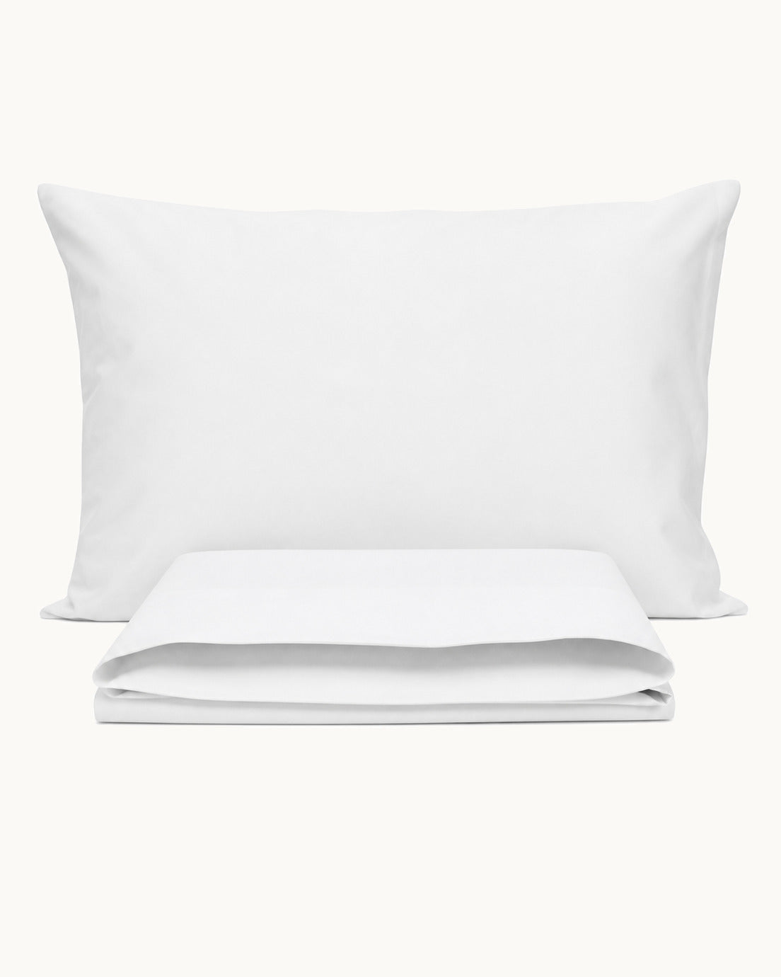 Cotton Percale Pillowcases, one case on a pillow, one folded, on a plain background