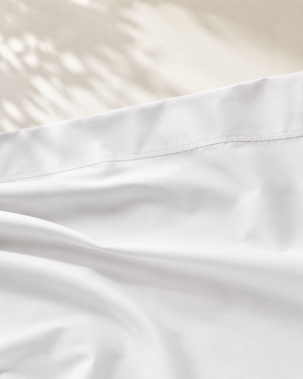 Egyptian Cotton Sheet Set, close-up on the wide top hem of the flat sheet