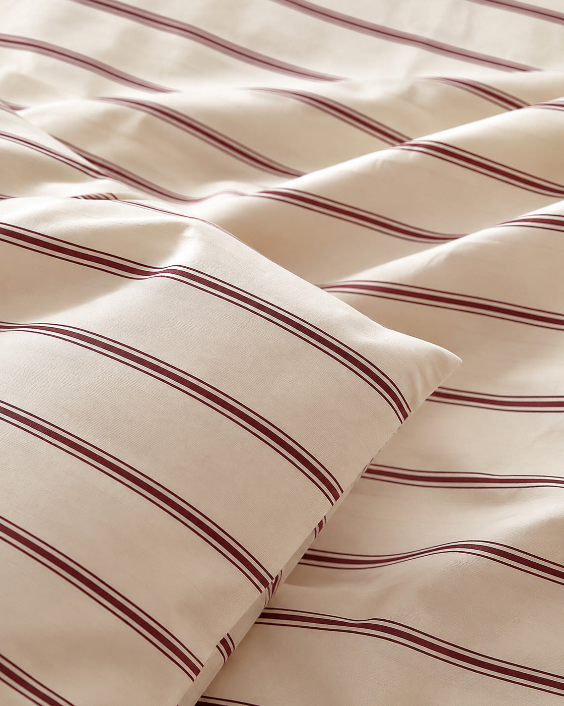 Woven Stripe Duvet Cover Set, close-up on a fold with the burgundy stripe