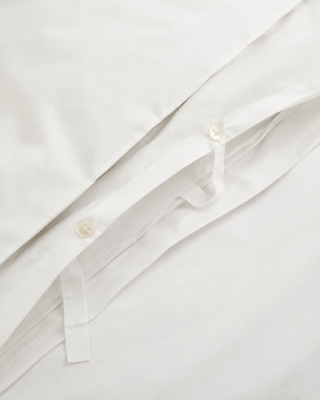 Cotton Percale Duvet Cover, close-up on the button closure