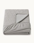 Quilted Mattress Protector — folded set on a plain background
