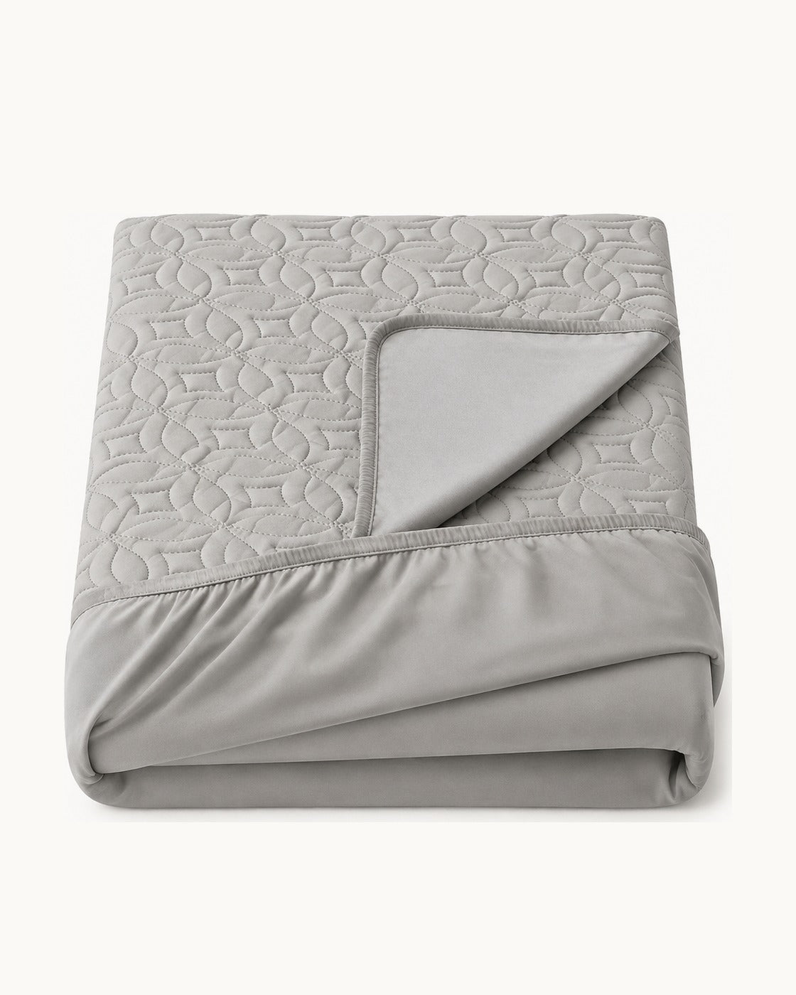 Quilted Mattress Protector — folded set on a plain background
