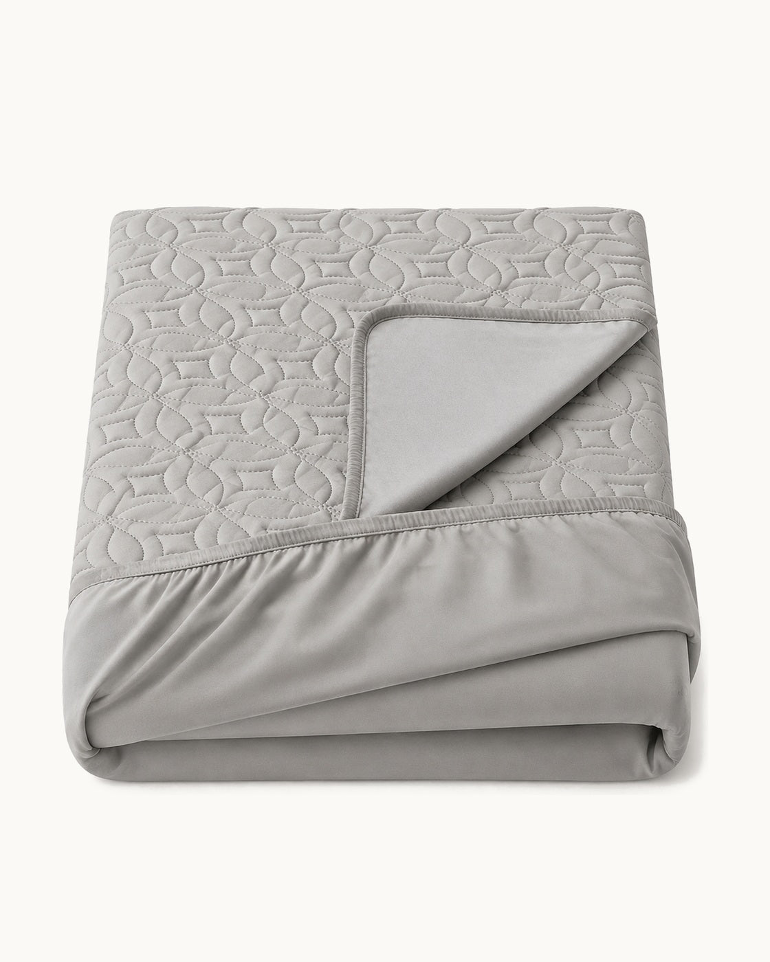 Quilted Mattress Protector — folded set on a plain background