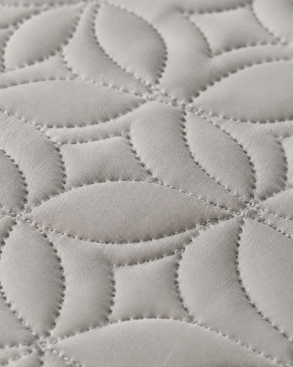 Quilted Mattress Protector — macro of the woven texture