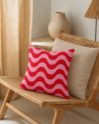 Red Wave Stripe Cotton-Linen Pillow Cover, on a rattan armchair