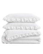 Ruffled Bubble Cotton Seersucker Duvet Cover Set in White, folded with its shams
