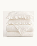 Ruffled Seersucker Duvet Set — folded set on a plain background