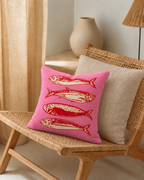 Sardine Print Cotton-Linen Pillow Cover, on a rattan armchair
