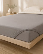 Solid Fitted Sheet — on a made bed, morning light