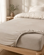 Textured Solid Fitted Sheet — on a made bed, morning light