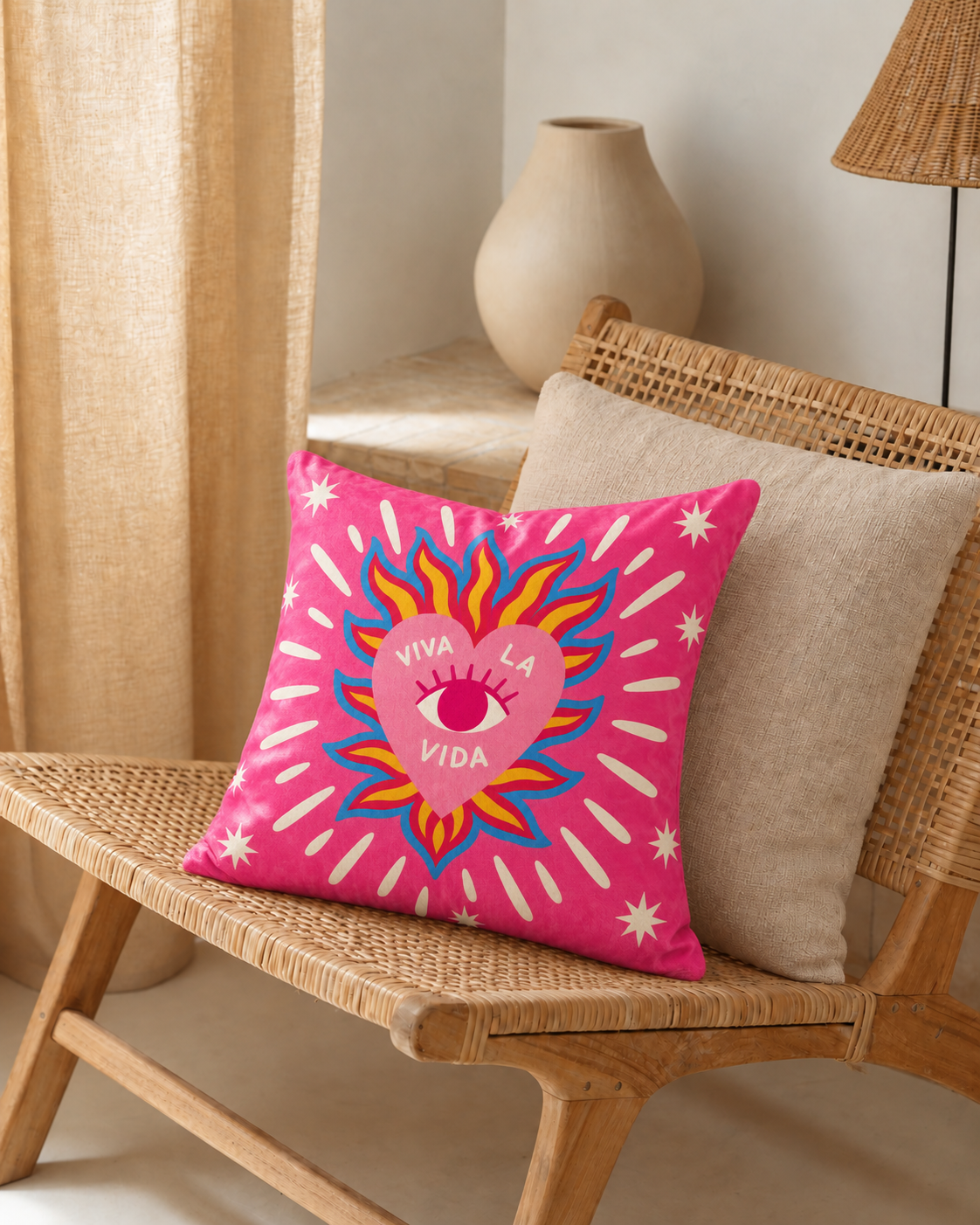 Viva la Vida Heart Cotton Velvet Pillow Cover, on a rattan armchair