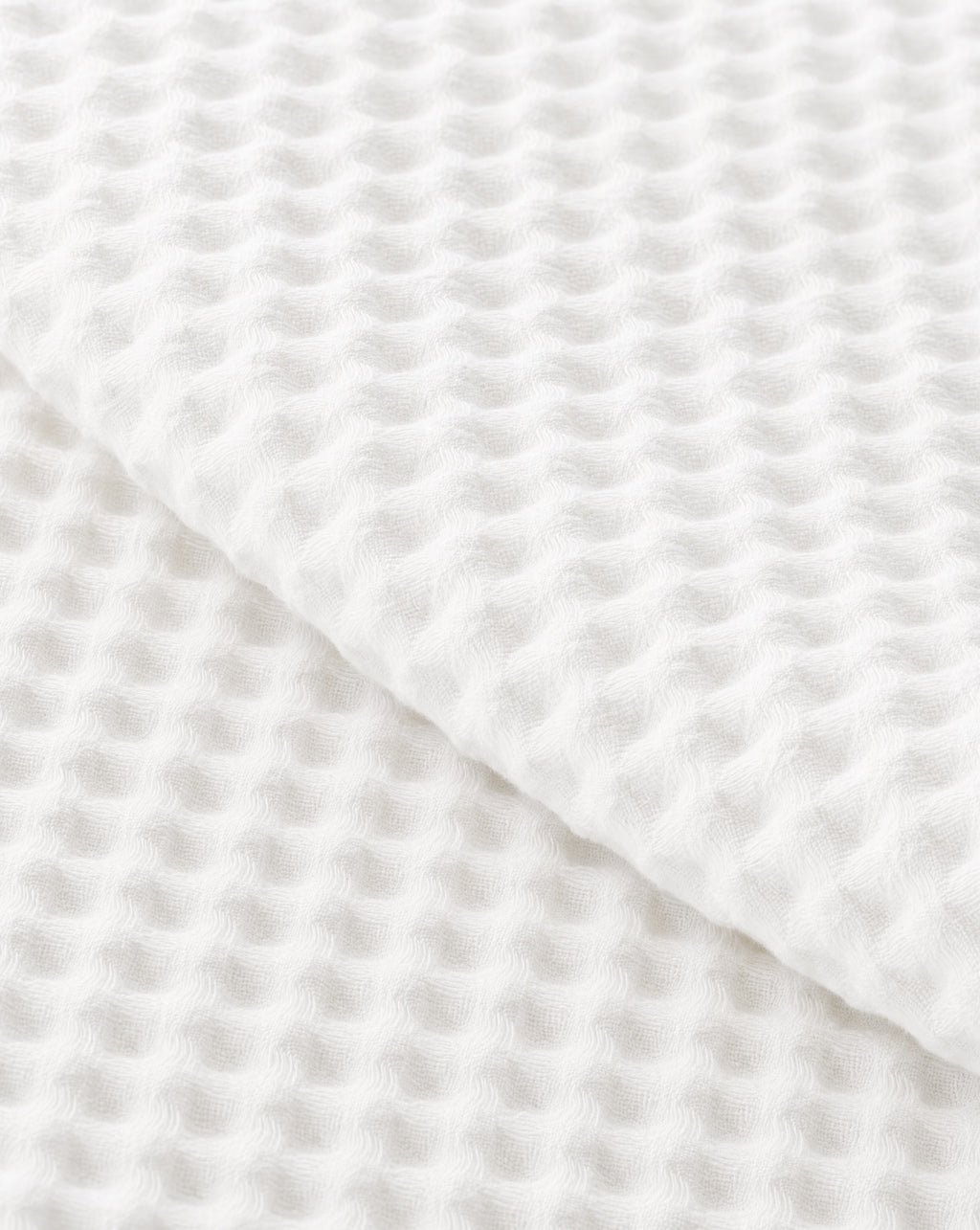 Waffle Cotton Coverlet — close-up on a fold