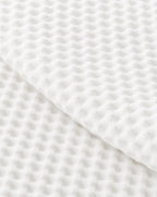 Waffle Cotton Coverlet — close-up on a fold