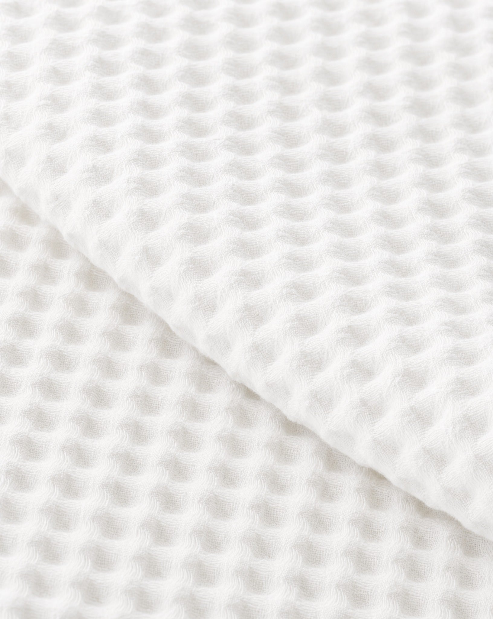 Waffle Cotton Coverlet — close-up on a fold