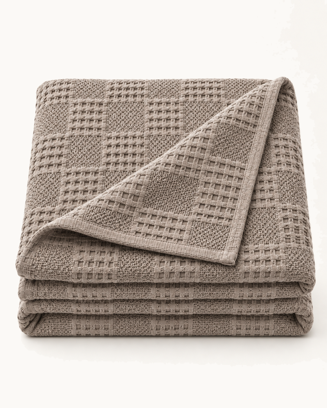 Waffle Knit Throw, folded on a plain background