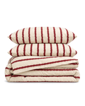 Wavy Stripe Washed Cotton Duvet Cover Set in Cherry, folded with its shams